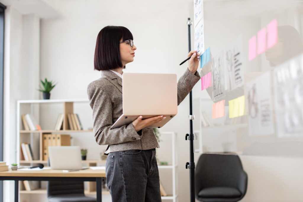 Female administrative manager preparing for presentation at work.